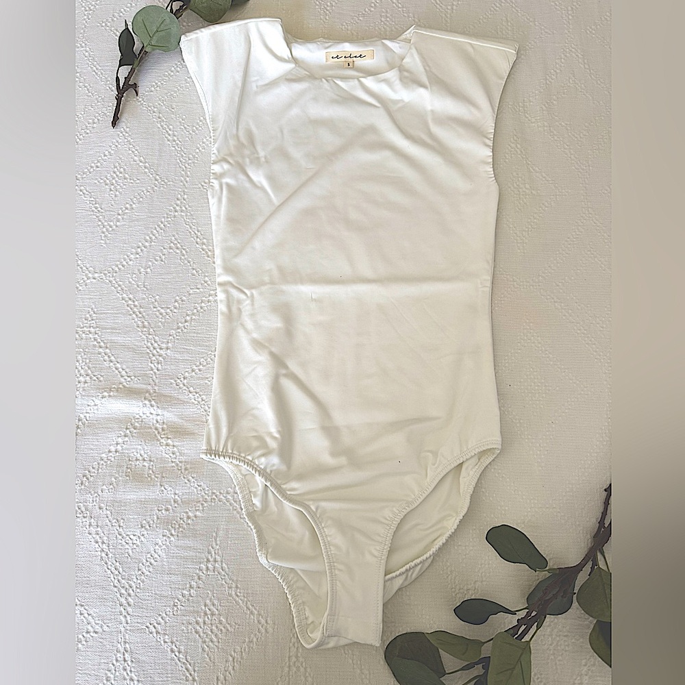 et clet white bodysuit w/ shoulder pads (NEW)